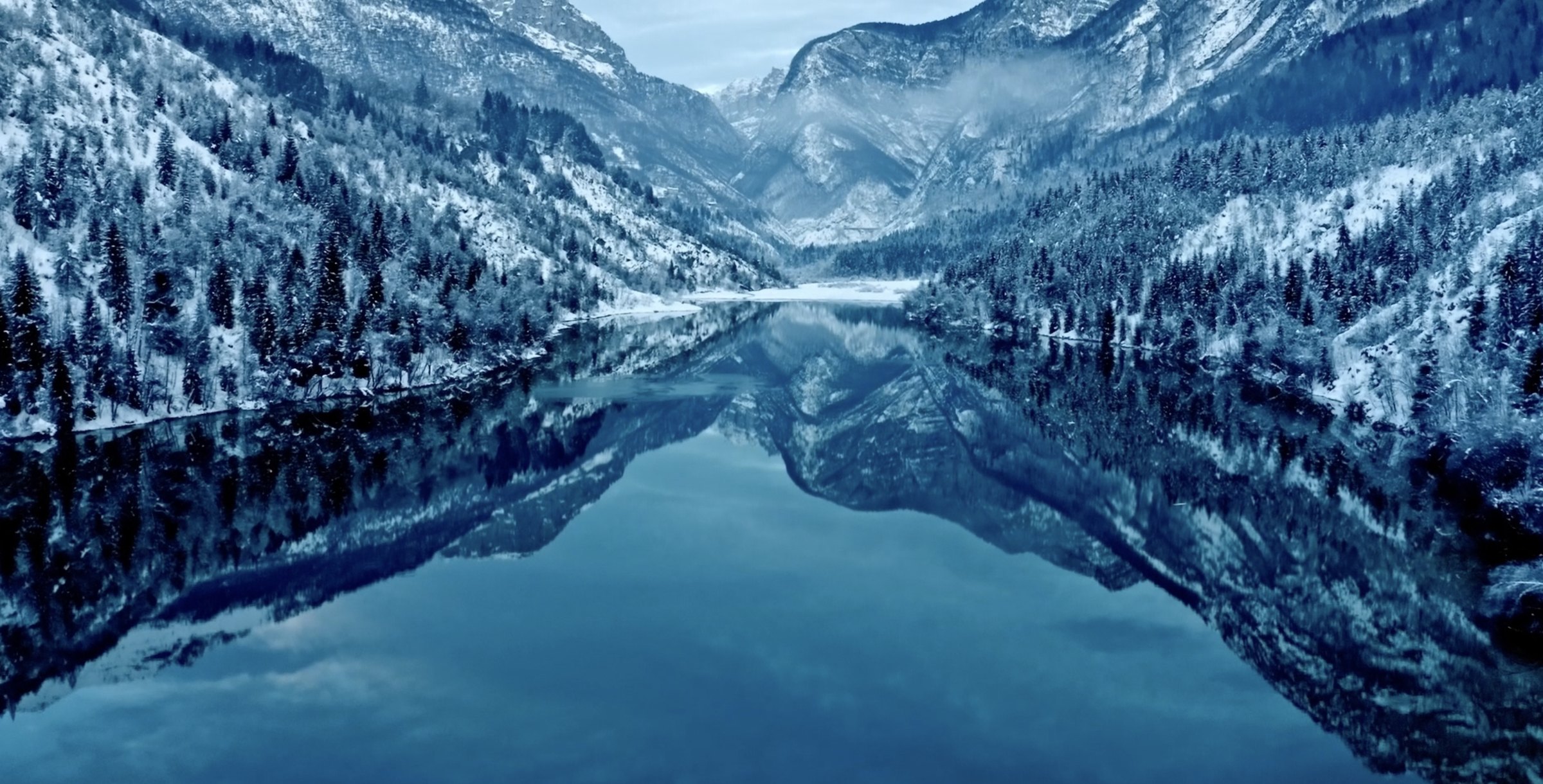Erto: The Moon Beneath the Water — winter lake in the Dolomites